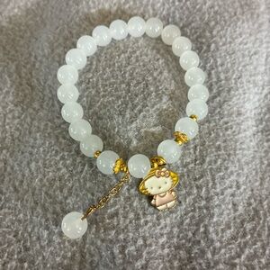 Gold and White Beaded Bracelet with Charm
